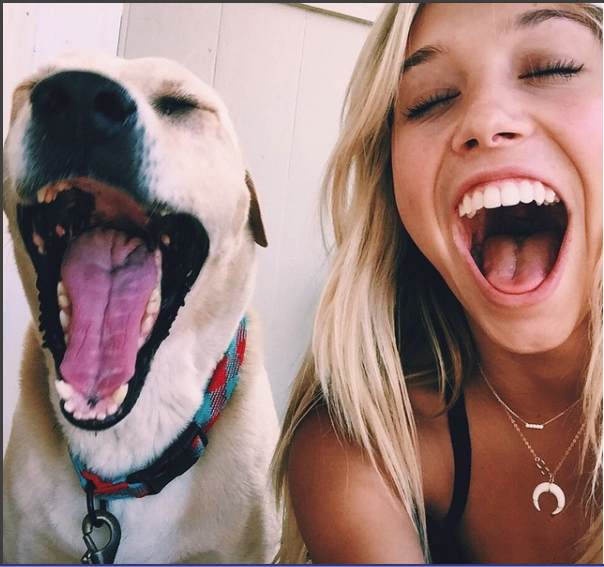 Alexis Ren funny face with her dog