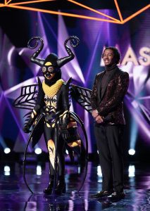 The Masked Singer Bee Costume and Host, Nick Cannon on Episode 2