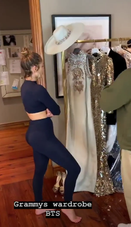 JLo looking at wardrobe choices for the 2019 Grammy Awards | Credit: AROD/Instagram