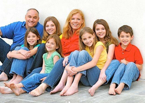 Joshua Bassett with his parents and 5 sisters