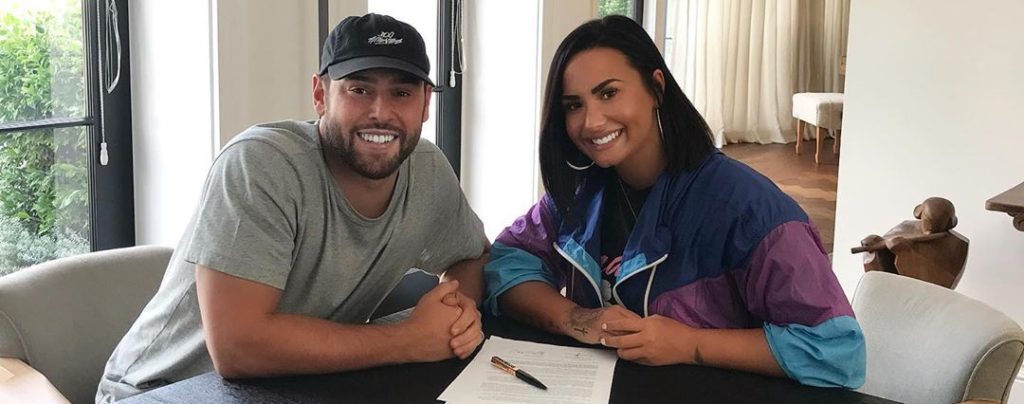 Demi Lovato Celebrates New Contract with Ariana Grande and Justin Bieber’s Manager