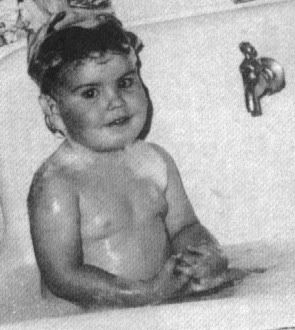 Jordan Knight as a baby taking a bath