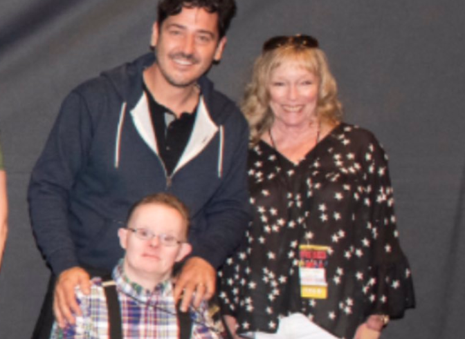 Jonathan Knight with his fan Tommy and Tommy's mother at a Meet & Greet in 2019.