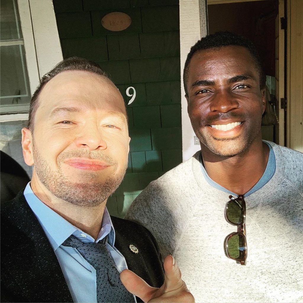 Donnie Wahlberg with Taylor Sele on the set of Blue Bloods Season 10