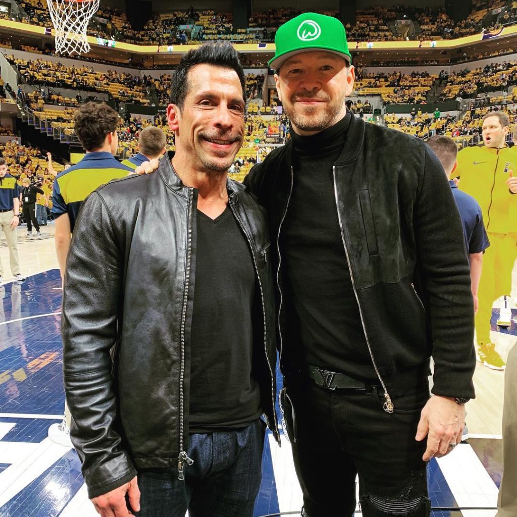 Danny Wood taking in a ballgame with Donnie Wahlberg