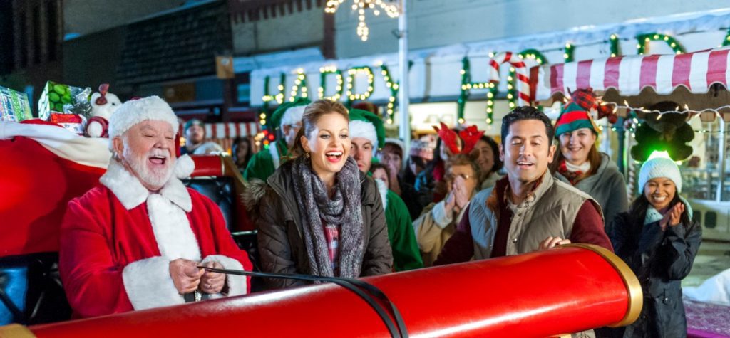 Scarf and red plaid shirt in 'Christmas Under Wraps' on Candace Cameron Bure