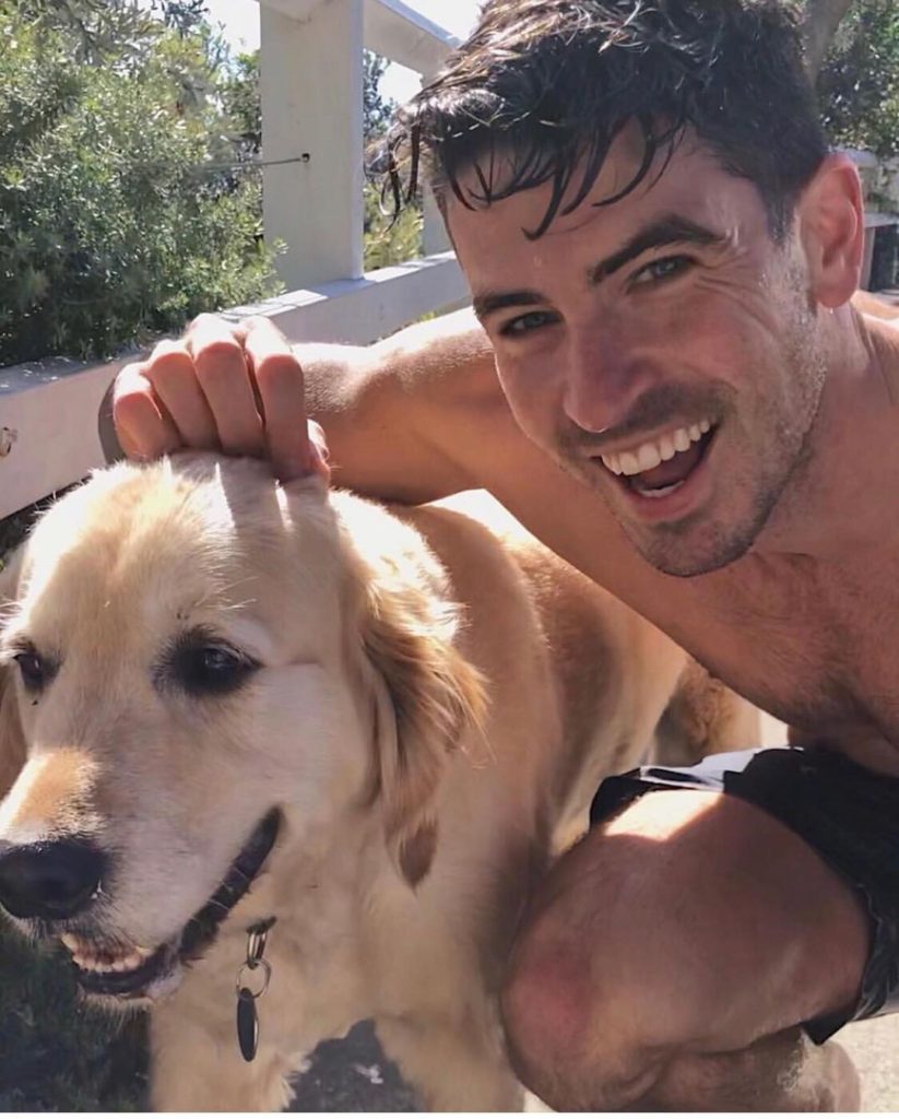 Scott Tweedie with a golden retriever