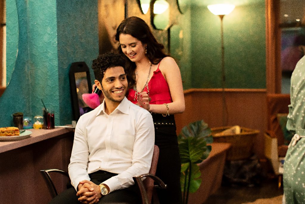 Mena Massoud and Laura Marano in The Royal Treatment