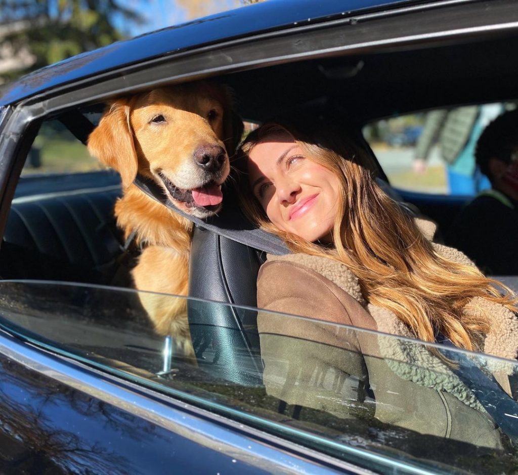 Perry Mattfeld from In the Dark with Pretzel her golden retriever guide dog