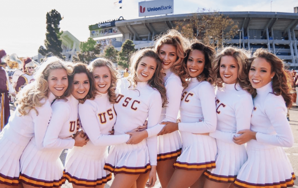 Perry Mattfeld as a cheerleader in college