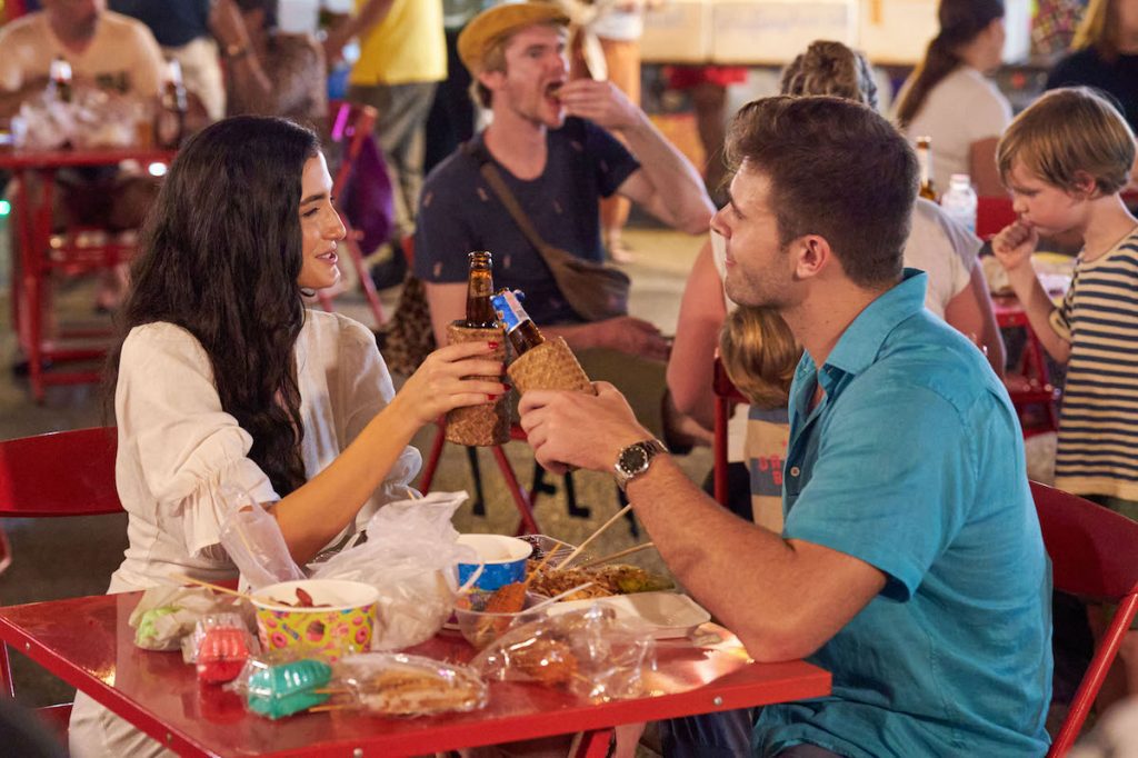 Ariel and Zach on their Fantasy Suites Week date at the street fair