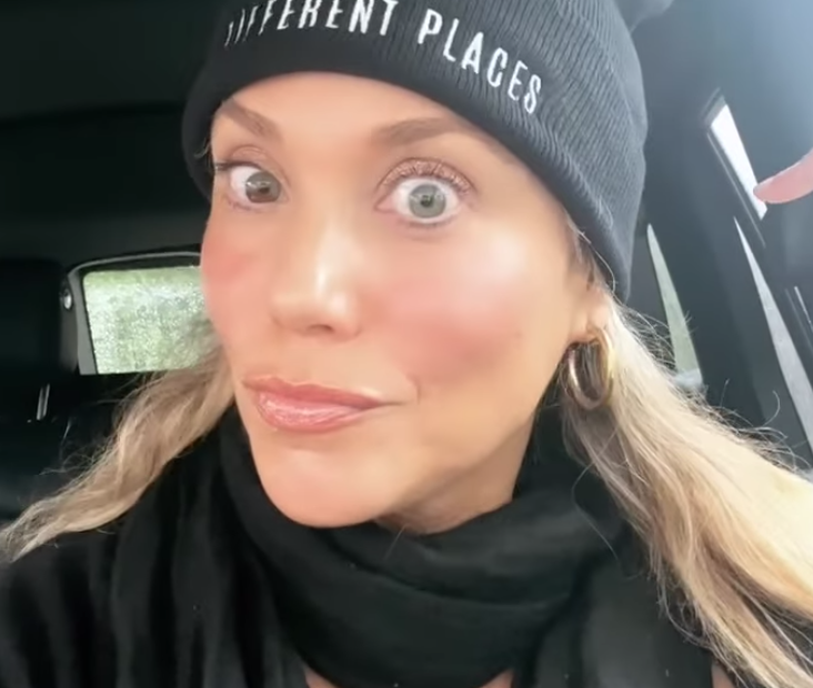 Elizabeth Berkley wearing the "Different Places" beanie hat